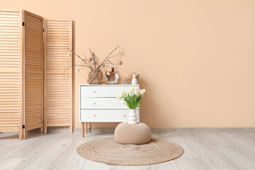 Interior of living room with commode and Easter decor