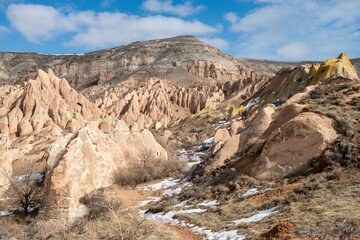 Rock formations of the Red Valley (Valley of Roses), Cappadocia, Turkey , in winter.
