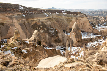 Rock formations of the Red Valley (Valley of Roses), Cappadocia, Turkey , in winter.