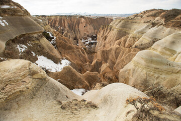 Rock formations of the Red Valley (Valley of Roses), Cappadocia, Turkey , in winter.