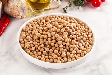 Dry chickpea seeds heap in the bowl