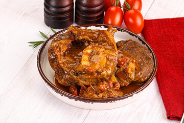 Italian cuisine - ossobuco with sauce