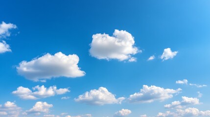 Fototapeta premium Sunny day, fluffy white clouds drifting across a vibrant blue sky, background blurred, ideal for serene website backgrounds