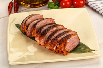 Sliced duck breast baked with cherry