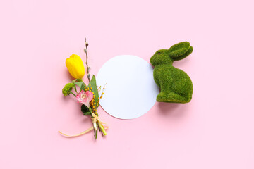Blank card with toy bunny and flowers on pink background. Easter celebration