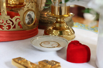 Golden wedding rings on the altar in the church.