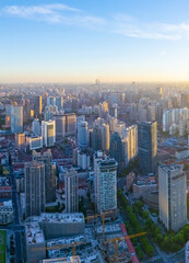 Fototapeta premium Aerial view of Shanghai skyscraper and residential houses at sunrise