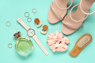 Sandals, scrunchy and bijouterie on turquoise background
