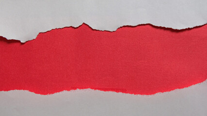 Red piece of paper with torn edges and soft shadow are on transparent background for text or ad.