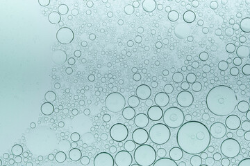 Macro microscope green bubble texture, Close-up Green bubbles and drops oil background . blue green water bubbles, close up golden oil drop for cosmetic...