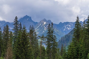 View of the peaks of the Tatra Mountains in Poland. Beautiful landscape with mountains and clouds.