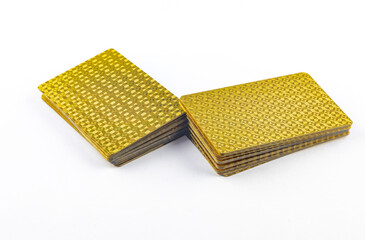 Gold colored poker playing cards, deck of cards on white background, gold