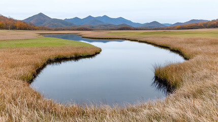 Serene autumnal wetland, mountain backdrop, calm water, nature photography, travel