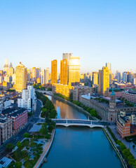 Obraz premium Aerial view of Shanghai skyscraper and residential houses at sunrise