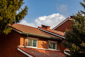 a brown-block building facing the sky