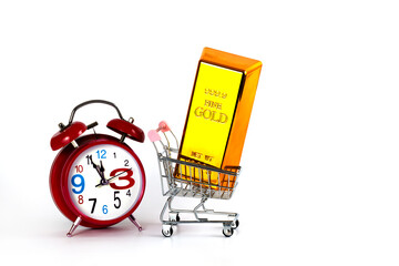 999 gold bar in a miniature shopping cart from a supermarket