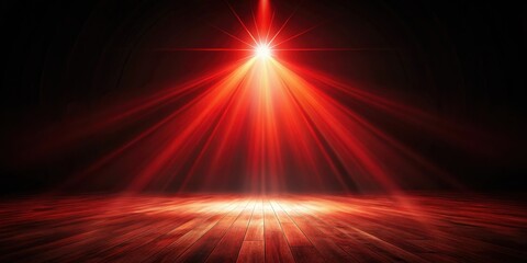 A single spotlight shines brightly on a wooden floor, casting warm red beams of light in a dark space