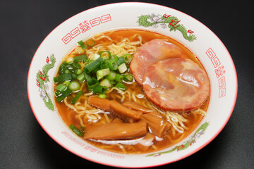 Soy sauce ramen noodles with grilled pork, bamboo shoots, and green onions, a noodle dish that has long been a favorite in Japan