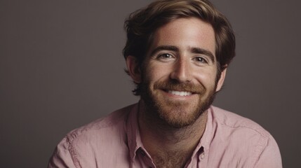 Obraz premium Smiling man headshot, studio portrait, gray background, website profile