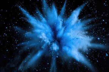 A blue powder explosion in mid-air on a black background