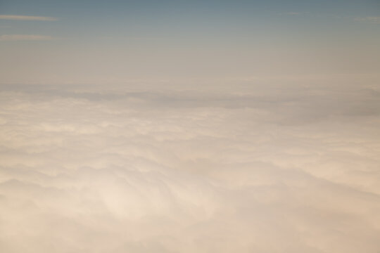 background with sky and clouds; view from the window of an airplane