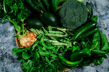 pile of green vegetables from the farm market fresh and clean, green beans, cucumbers, green peas, avocado, broccoli, green pepper, dill, celery