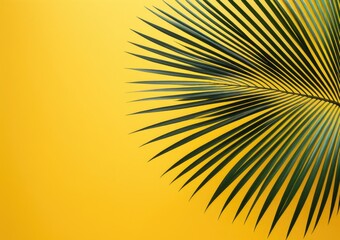 Fototapeta premium Vibrant tropical palm leaf against a bold yellow background