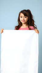 Fototapeta premium A young brunette teenage girl holding a large white banner, simple style. isolated with white shades