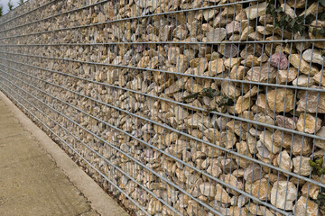 Gabion fence around a house