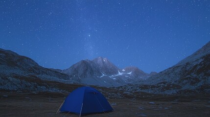 Mountain camping under starry night sky