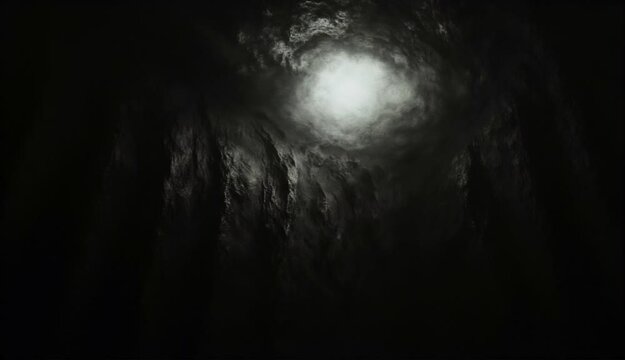 Paisaje oscuro y siniestro con nebulosas y nubes que se van moviendo alrededor de un punto de luz al fondo