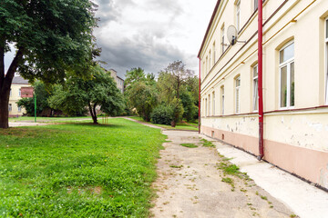 View of an old typical courtyard of the Soviet era. Russian poverty and ruin. Living conditions of the middle class population.