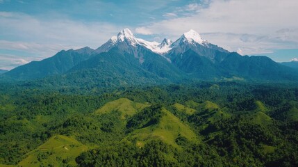 Fototapeta premium Majestic Snow-Capped Mountains Surrounded by Lush Green Valleys