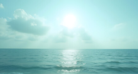 Obraz premium Serene Ocean View with Bright Sunlight and Clouds