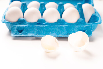 Delicious homemade pie, sprinkled with powdered sugar, on a blue plate with a blue napkin and a spoon. Top view, close-up