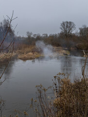 Cloud of smoke over the Swider River, Masovia, central Poland