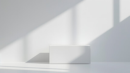 Minimalist white object casting shadows in bright, natural light on a plain surface