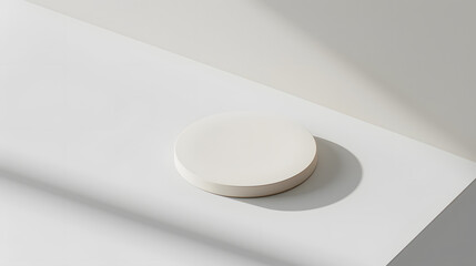Fototapeta premium Minimalistic circular object placed on a clean surface with soft light highlights the modern aesthetic