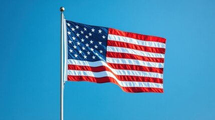 Fluttering American Flag waving in the Wind against a Clear Blue Sky Background  The iconic national symbol of the United States of America representing patriotism freedom and democracy