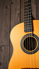 Obraz premium Closeup of old acoustic spanish guitar on rustic wooden background from above, Dynamic motion. isolated with white shades
