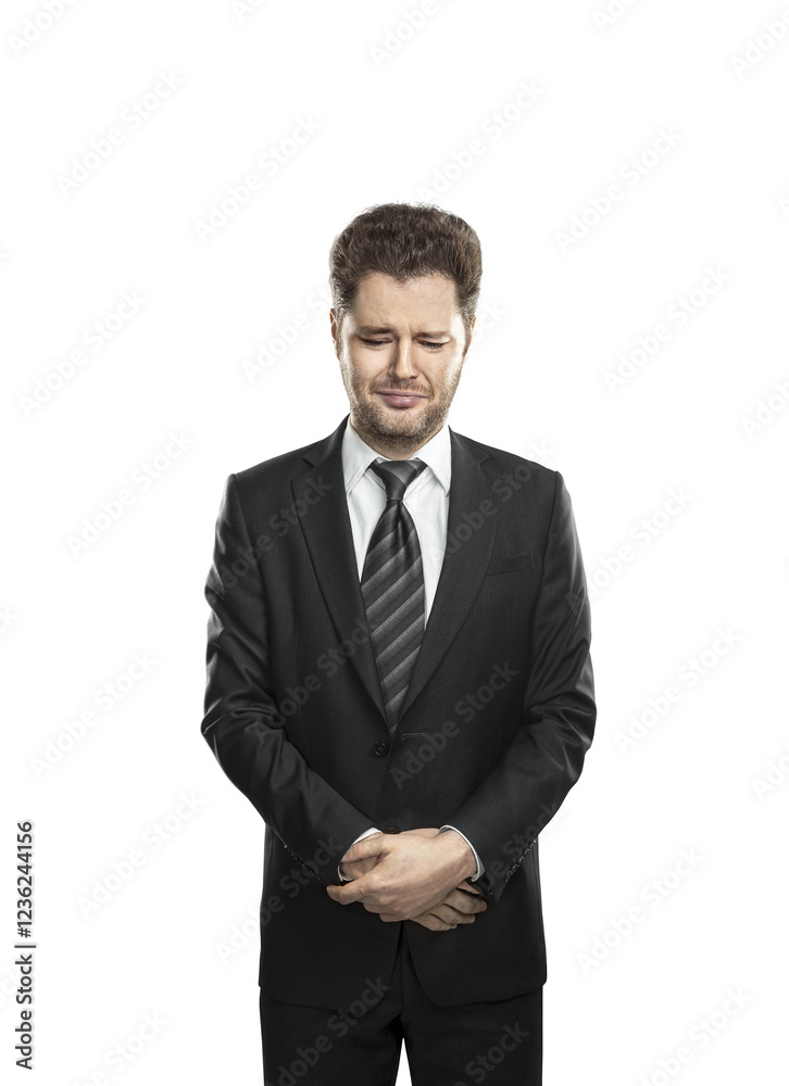 Poster Man in formal attire with a suit and striped tie, standing with hands clasped and a distressed facial expression. Isolated on a white background