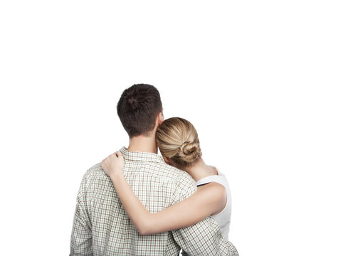A couple hugging closely, viewed from behind, with the woman's head resting on the man's shoulder, isolated on a clean white background