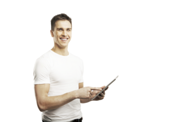 Smiling man holding and using a tablet, dressed in a white t-shirt, isolated on a plain white background. Concept of technology and casual modernity
