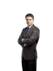 Professional businessman in a pinstripe suit standing confidently with arms crossed. Isolated on a white background. Corporate concept