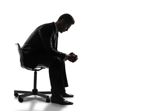 Silhouette of a man in a suit sitting on a chair, leaning forward with clasped hands in a contemplative pose, isolated on a white background - Powered by Adobe