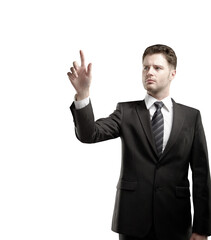 Professional businessman in a formal suit pointing forward with a focused expression, isolated on a white background. Concept of decision