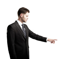 A businessman in a formal suit pointing to the side, isolated on a clean white background. Professional gesture concept, clean layout