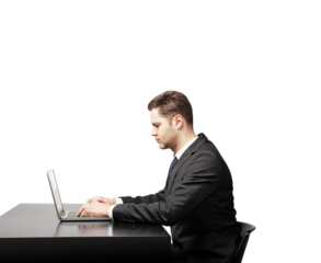 Businessman in formal suit typing on laptop at desk, isolated on white background. Professional work concept, clean minimalist layout