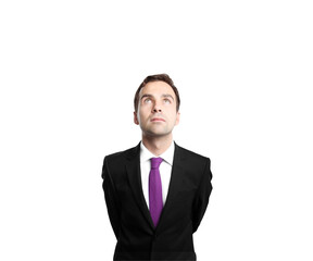 Businessman in asuit with a purple tie gazing upward. Isolated on a clean white background. Concept of aspiration and professionalism