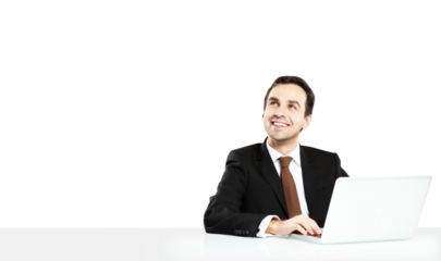 Businessman in a suit with a tie working on a laptop, smiling and looking upward. Isolated on a clean white background. Corporate concept